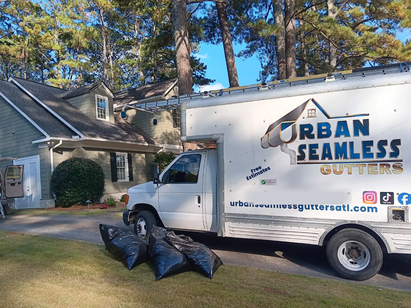 Urban Seamless Gutters ATL van at a recent Metro Atlanta job — competitor quotes matched on identical scope and materials
