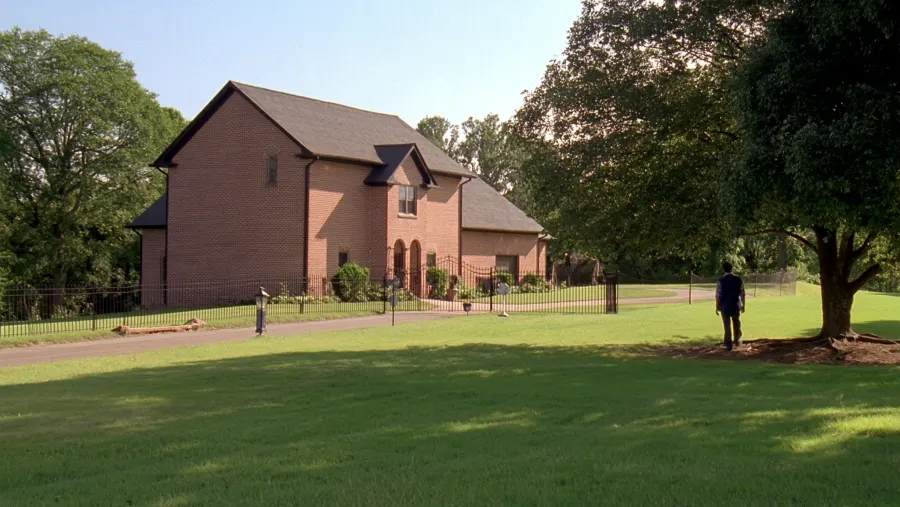 Classic brick home with black seamless gutters in the historic railroad town of Fairburn, GA