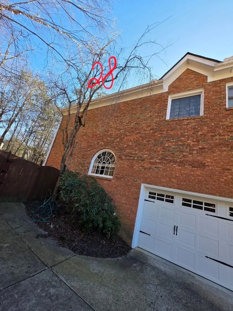 Estimate photo of the garage side with the gutter run length marked in red, in Alpharetta, GA