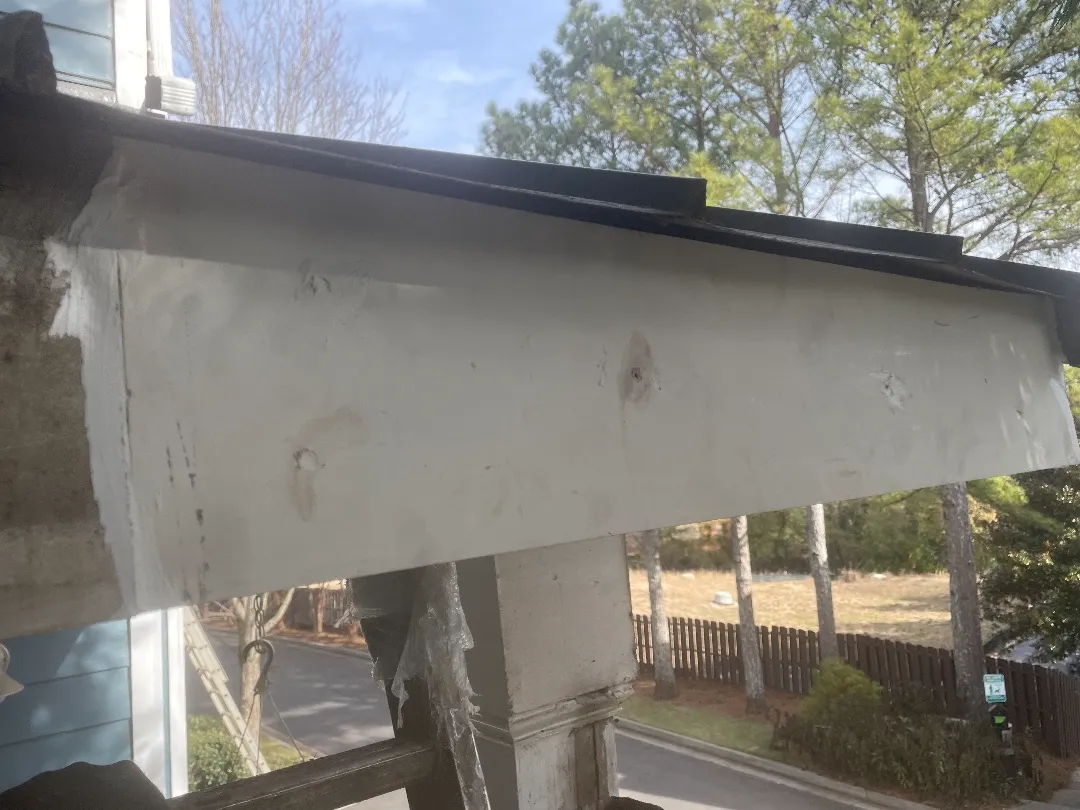 After: the same stretch with the rotted fascia replaced and painted white, ready for the new gutter, at an Atlanta, GA townhome