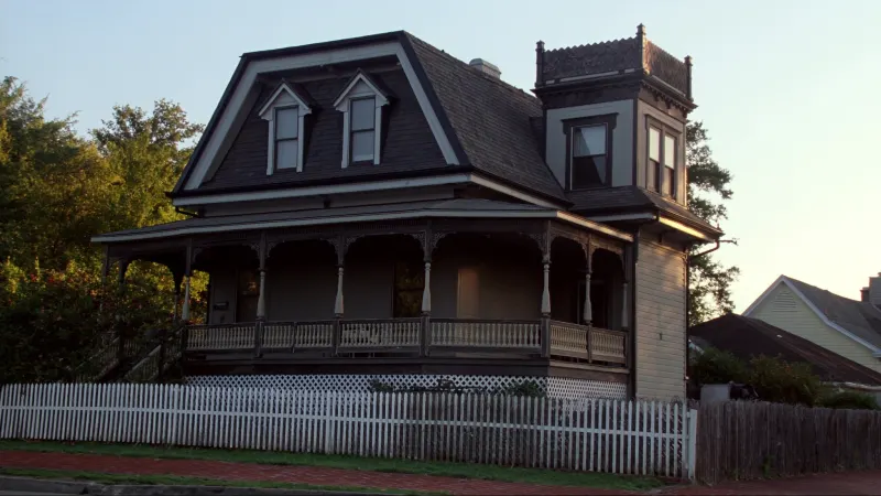 Victorian home near historic Marietta Square with black seamless gutters along its gabled roofline — Marietta, GA