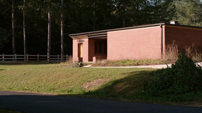 West Cobb brick ranch on a large lot with new black seamless gutters — Powder Springs, GA