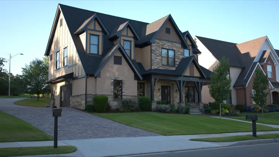 Craftsman-style Suwanee, GA home near Town Center with matte black seamless gutters and downspouts in Gwinnett County