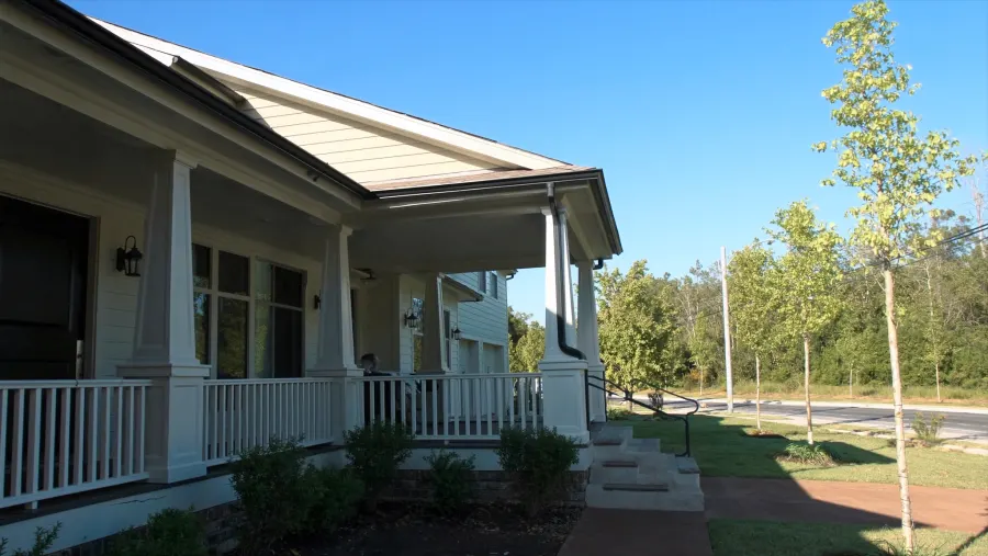 Craftsman-style home near Suwanee Town Center with matte black seamless gutters — Suwanee, GA